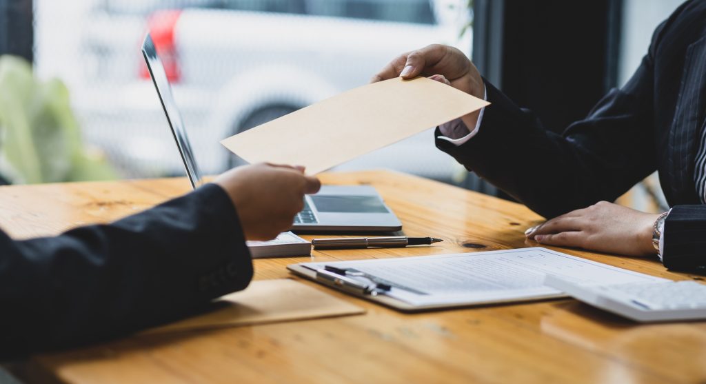 Businessman submitting legal documents litigation in agreement contract.