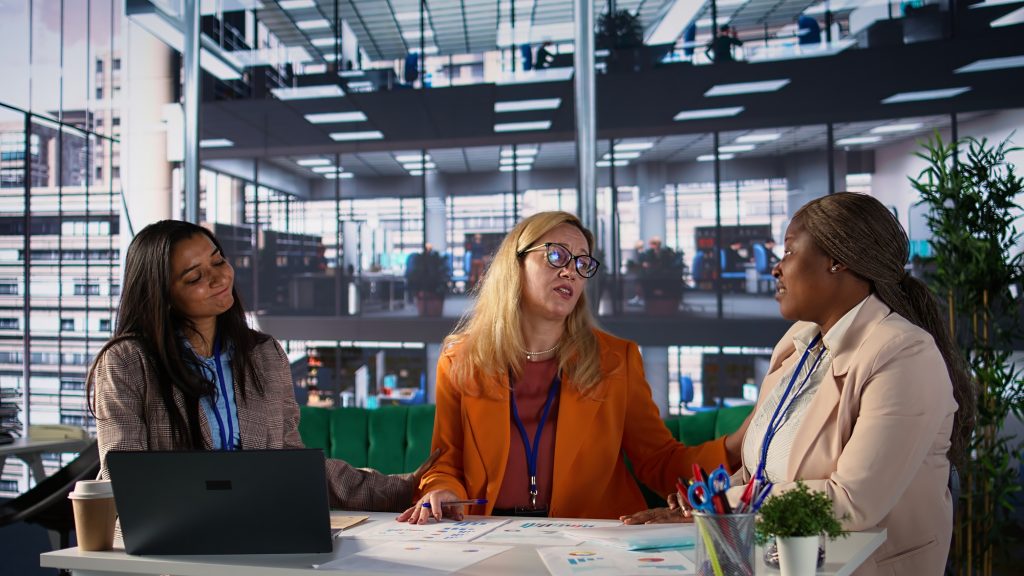 Businesswomen consoling their female boss after hearing bad news